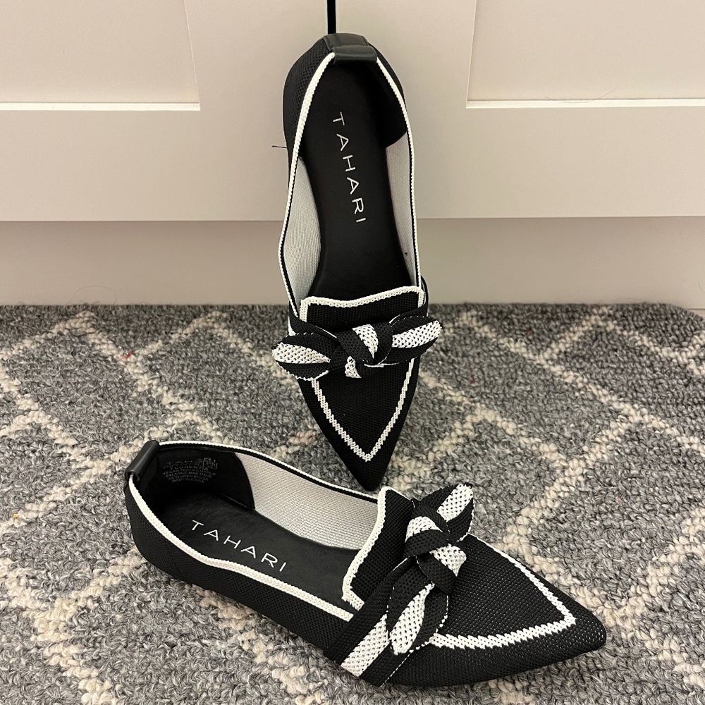 Classic black and white bow tie loafers